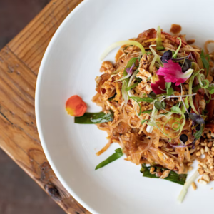 Pad Thai with green scallions on a plate